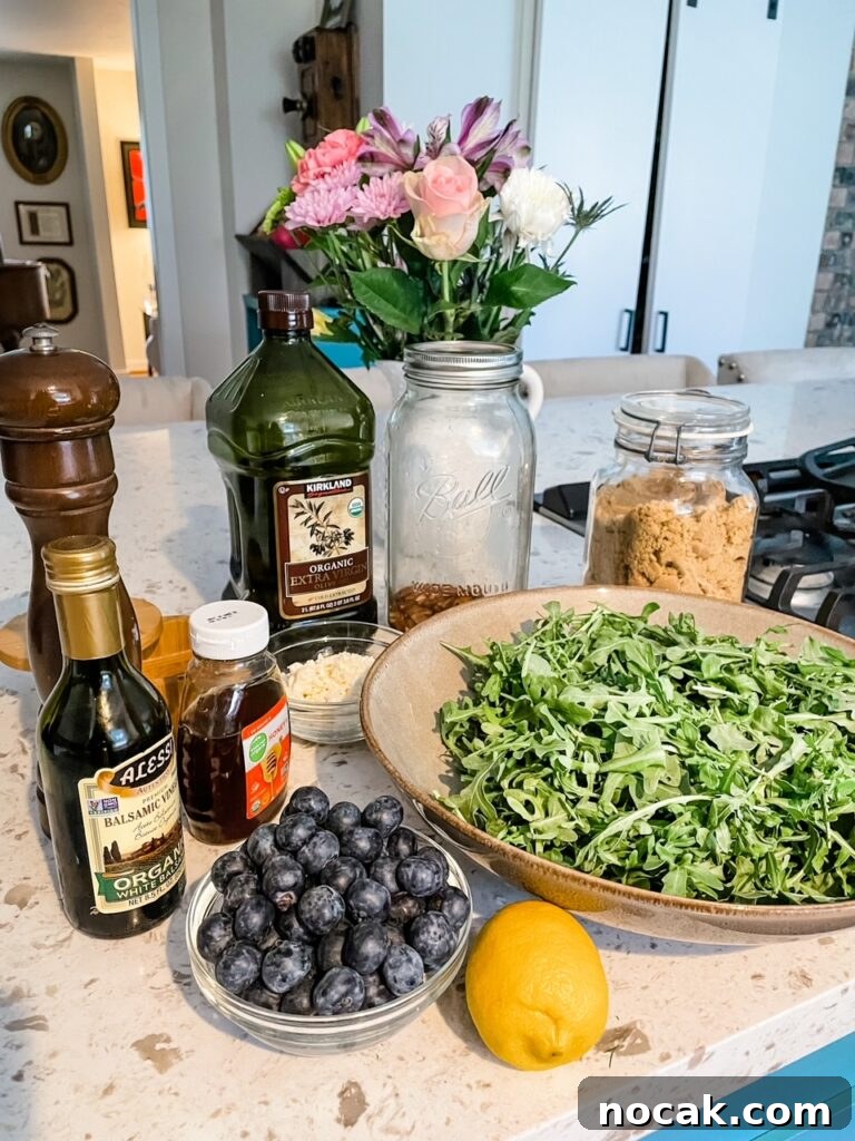 Summer Arugula Salad with Feta and Fresh Blueberries 4 The ingredients for the salad and dressing laid out on a countertop