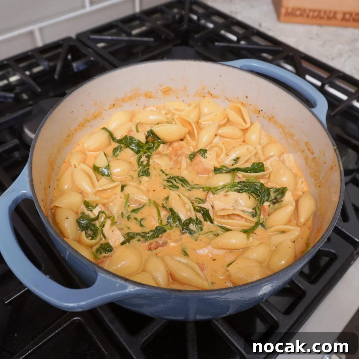 Marry Me Chicken Soup Recipe for Cozy Weeknight Dinners 8 Cooked Easy Marry Me Chicken Soup in blue dutch oven over stove top.