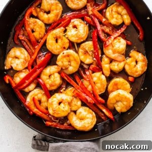 Authentic Kung Pao Shrimp Recipe with Crispy Peanuts and Chili 5 kung pao shrimp in skillet.