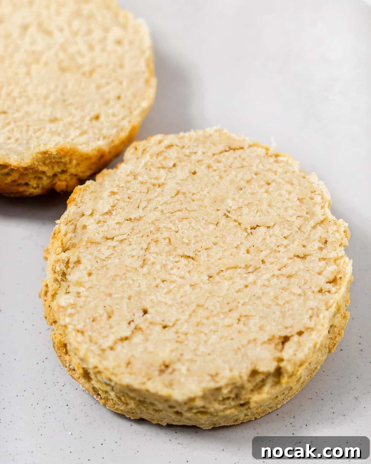 4-Ingredient Protein Scones Made Without Butter 5 A protein scone cut in half revealing the fluffy texture.