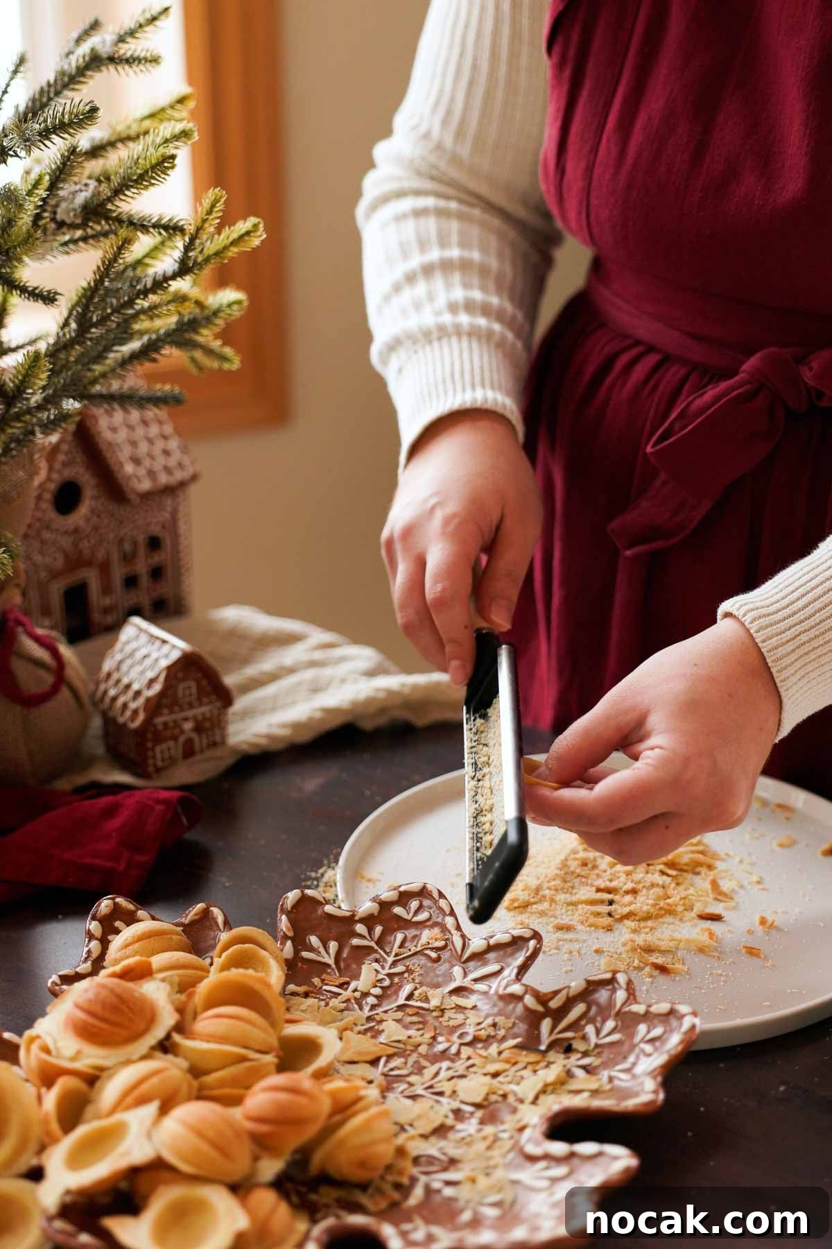 Oreshki Walnut Cookies Recipe — Russian Fillable Pastry Treats 11 grating the jagged ends off the walnut cookie halves