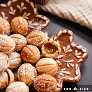Oreshki Walnut Cookies Recipe — Russian Fillable Pastry Treats 15 walnut shaped oreshki cookies on a plate