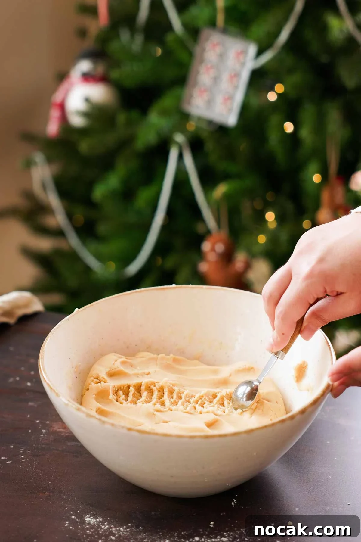 Oreshki Walnut Cookies Recipe — Russian Fillable Pastry Treats 8 measuring out teaspoons of dough from a large bowl