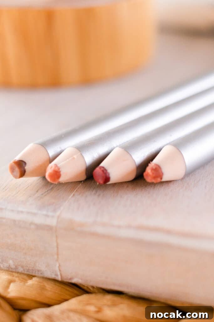 DIY Natural Makeup Recipes: Homemade Cosmetics for Glowing Skin 11 Homemade lip liner pencils on the edge of the vanity.