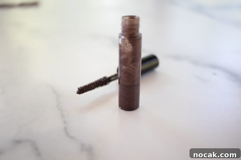 DIY Natural Makeup Recipes: Homemade Cosmetics for Glowing Skin 4 Diy eyebrow gel in a small glass container.