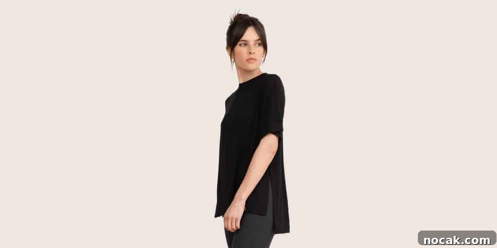 35 Ethical and Sustainable Loungewear Brands to Shop in 2024 11 A girl with a pony tail wearing a long black t-shirt and leggings.