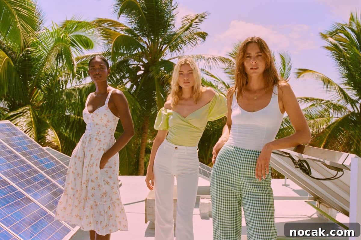 35 Ethical and Sustainable Loungewear Brands to Shop in 2024 4 Three girls on a rooftop surrounded by palm trees with one girl wearing a sundress.