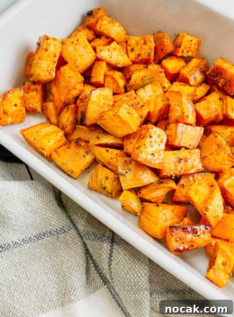 Maple-Glazed Roasted Sweet Potatoes with Crispy Edges 4 Maple roasted sweet potatoes on a platter.