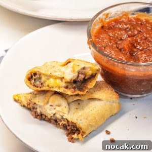 Taco sticks are made by wrapping taco meat and a colby-jack cheese stick in pizza dough then baking for 10 minutes for an easy weeknight meal recipe.