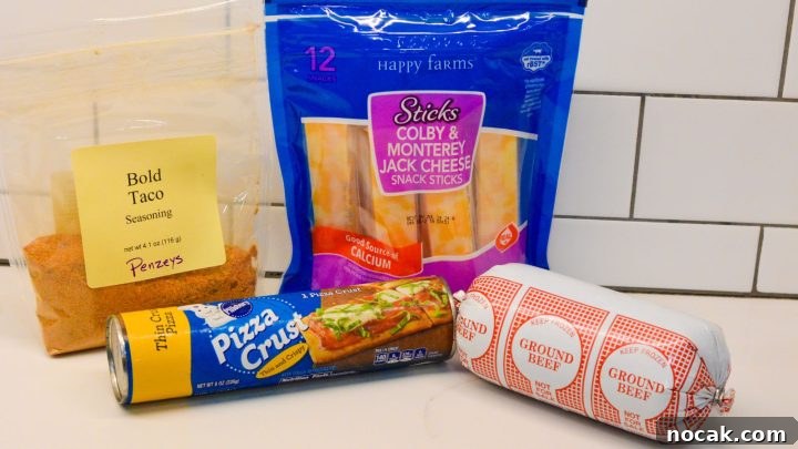 Crispy Taco Sticks Recipe: Flavorful Party Appetizers 3 Taco Stick ingredients - ground beef, Pillsbury pizza dough, taco seasoning, cheese sticks