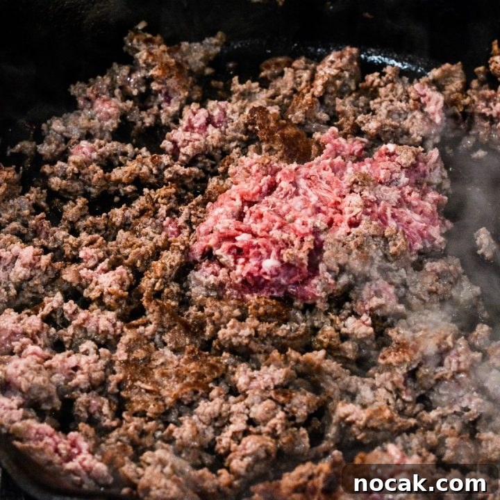 Crispy Taco Sticks Recipe: Flavorful Party Appetizers 4 Brown the ground beef in a skillet. Then stir in the taco seasoning and water and cook down the water.