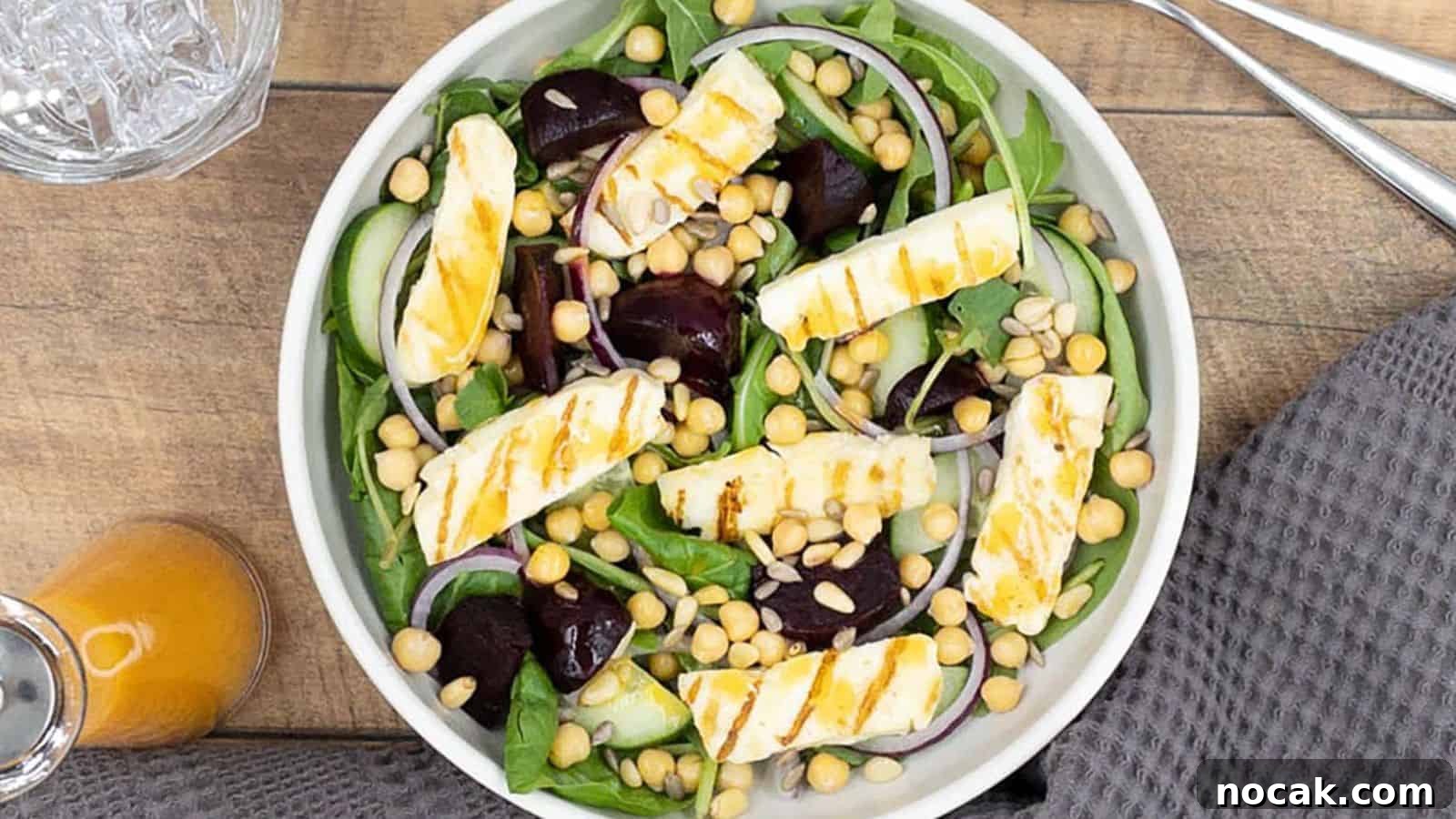23 Crowd-Pleasing Cookout Recipes for Memorial Day Weekend 14 Sliced halloumi cheese, beets and greens in a white ceramic bowl.