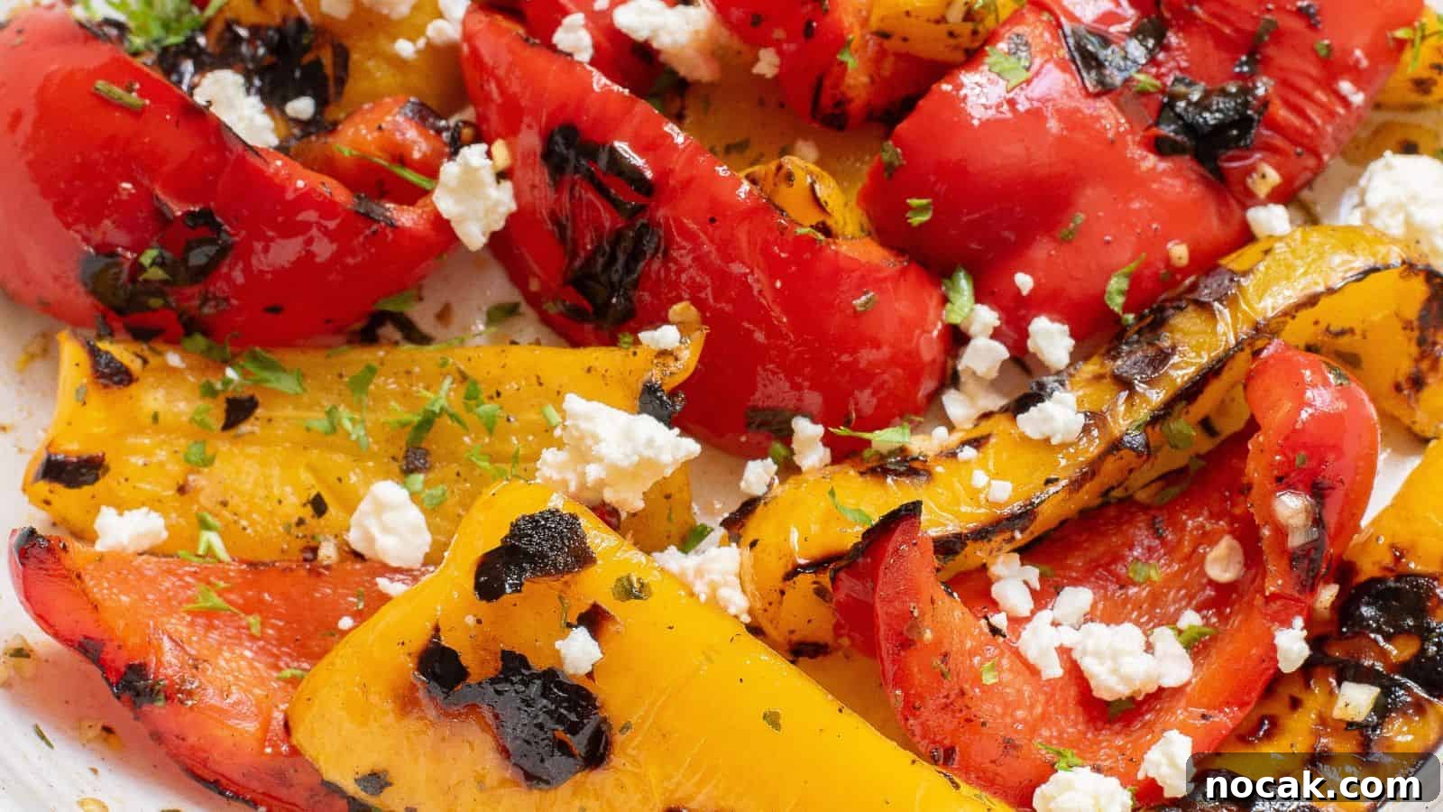 23 Crowd-Pleasing Cookout Recipes for Memorial Day Weekend 19 Grilled red and yellow bell peppers with char marks, topped with crumbled feta cheese and garnished with herbs.