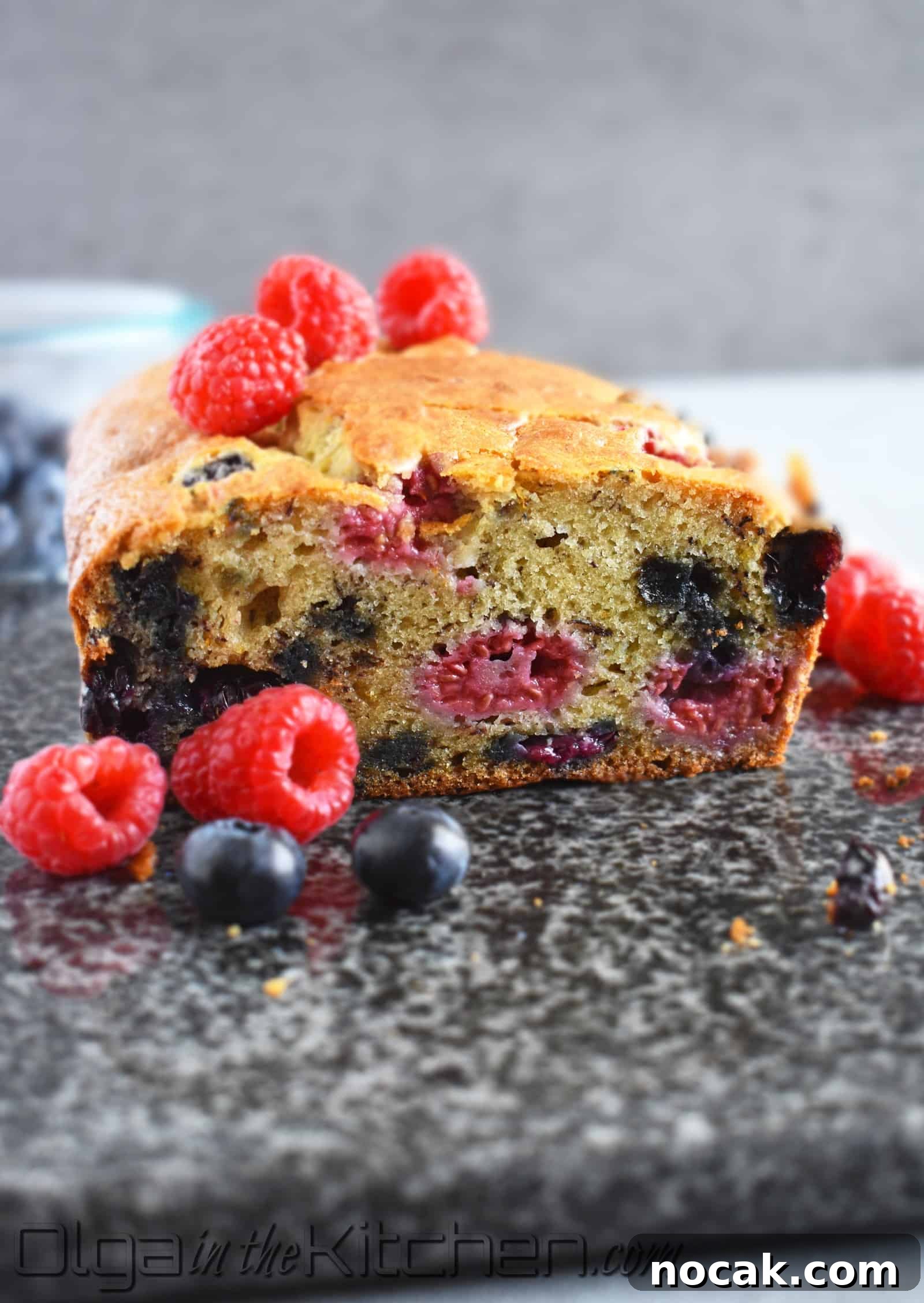 Banana and Berry Quick Bread Recipe for Moist, Flavorful Loaves 2 Banana Berries Bread: incredibly moist loaf of banana bread loaded with juicy and fresh blueberries and raspberries with a hint of orange. | olgainthekitchen.com