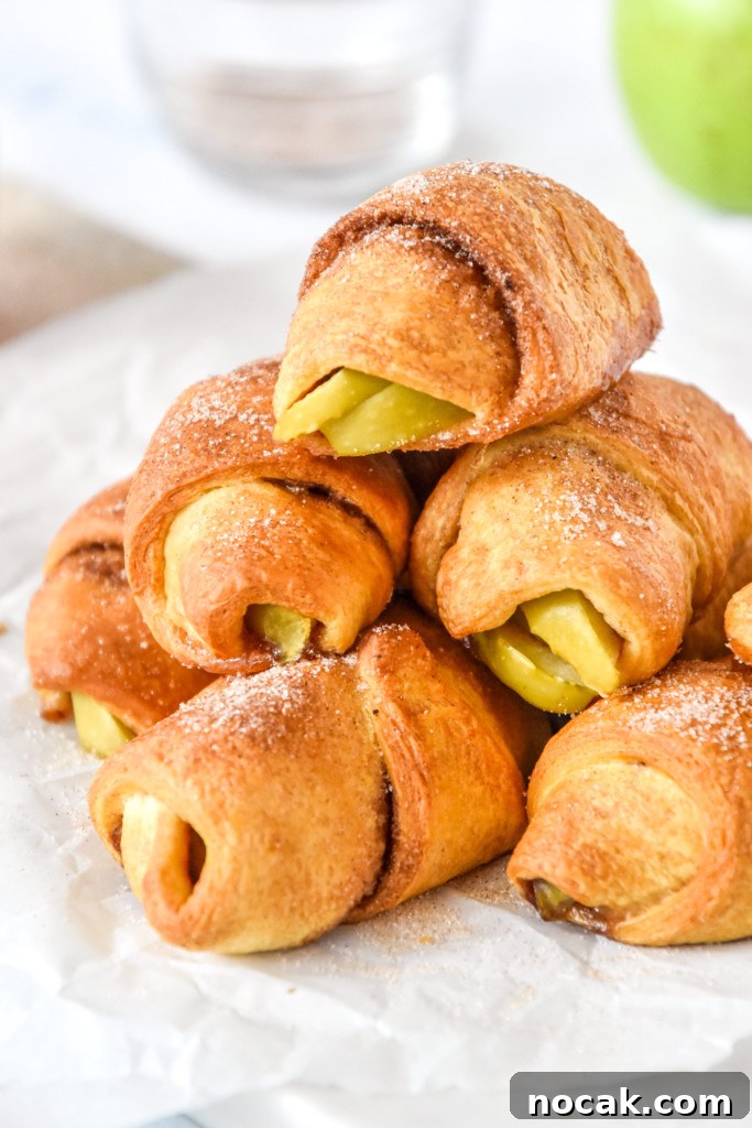 Air Fryer Apple Pie Crescent Rolls Recipe 2 stack of air fryer apple pie crescent rolls with cinnamon sugar on top.