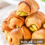 Air Fryer Apple Pie Crescent Rolls Recipe 17 stack of air fryer apple pie crescent rolls with cinnamon sugar on top.