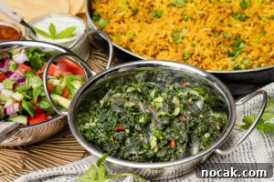 Saag Bhaji Recipe: Creamy Indian Spinach Curry with Spices 12 Saag Bhaji served in a Balti dish with keema rice and Indian onion salad served on the side