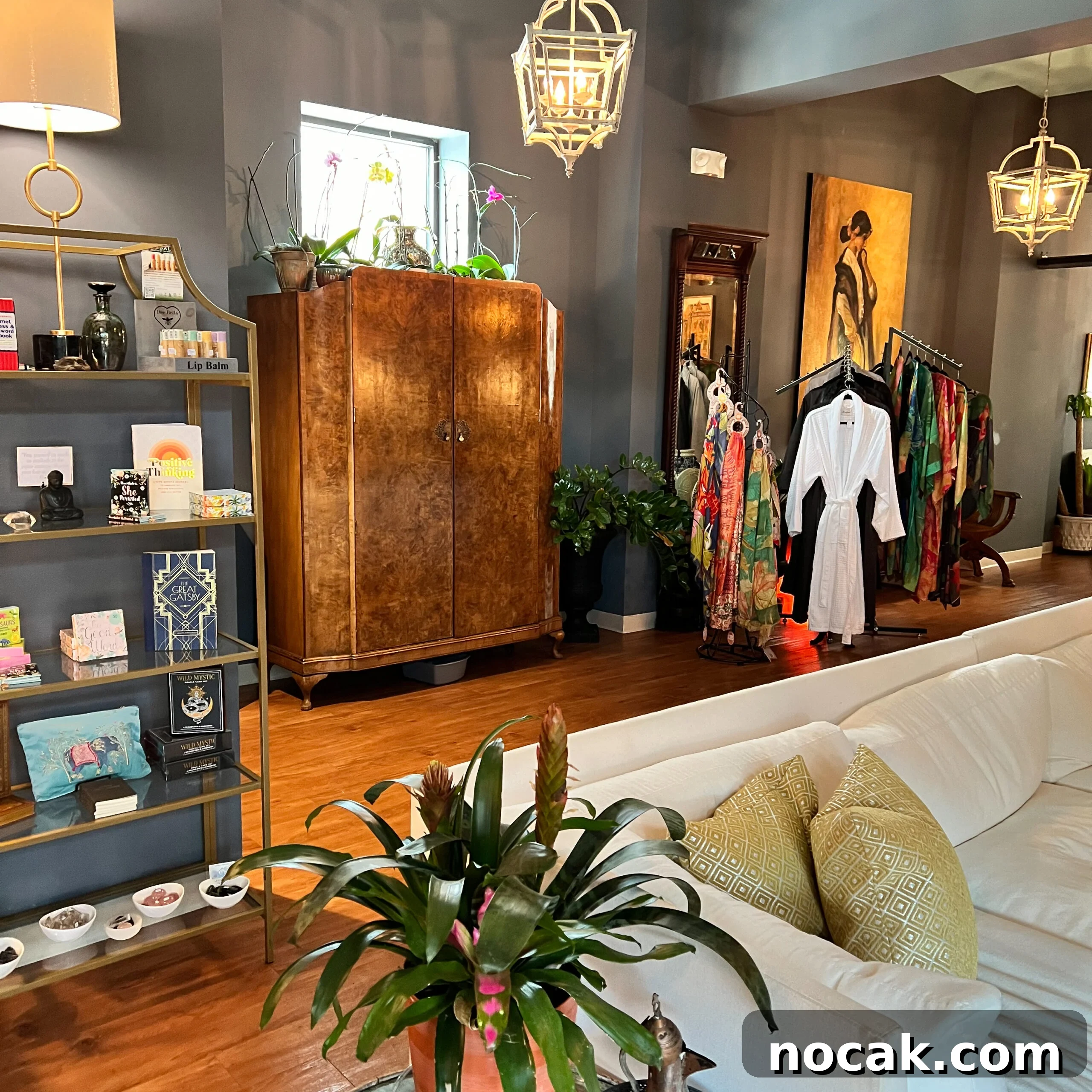 A cozy, romantic boutique interior with warm lighting and curated gifts.
