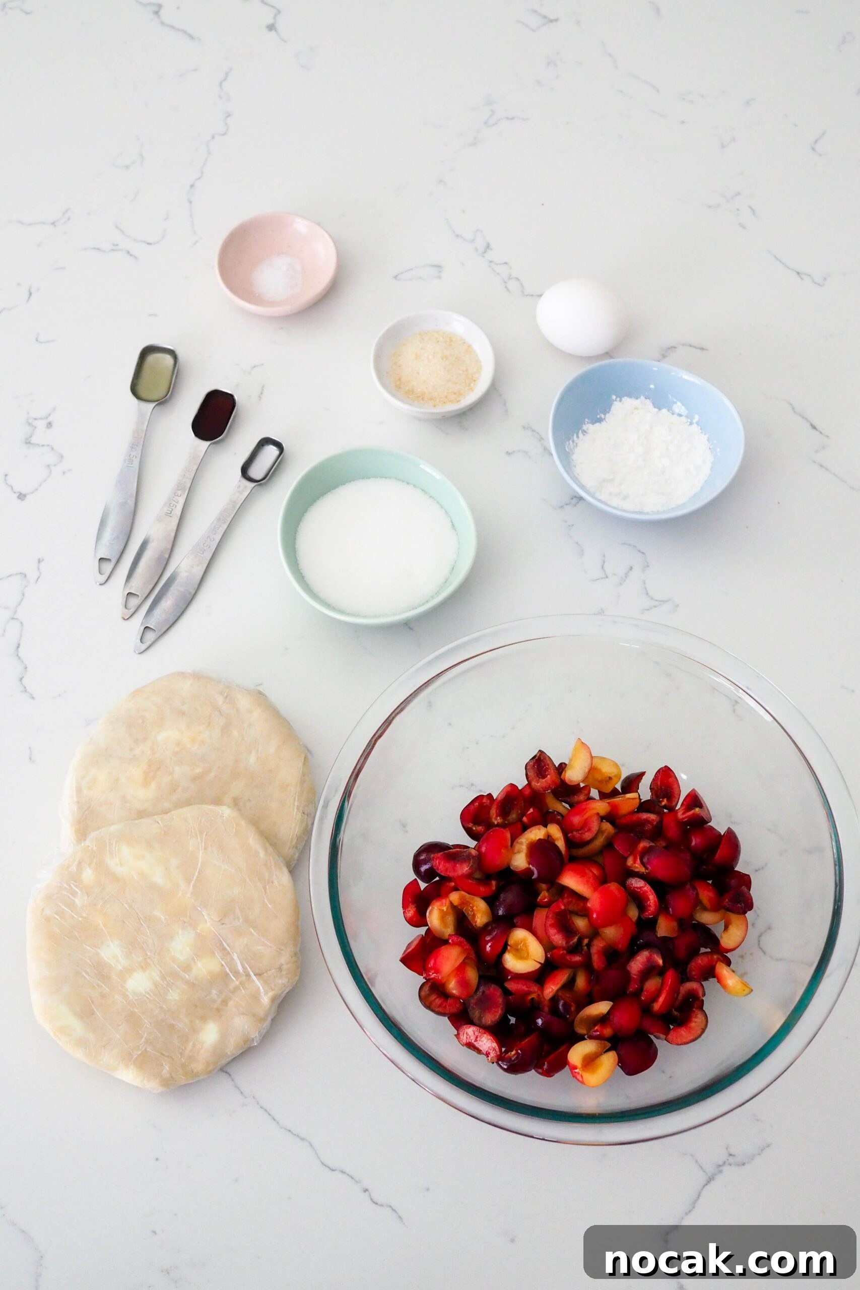 Mini Cherry Pies Recipe: Perfect Bite-Sized Cherry Hand Pies 3 Ingredients for mini cherry pies laid out on a counter.