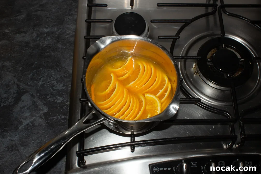 Sticky Orange Glaze Cake Recipe with Zesty Citrus Flavor 24 Semicircle orange slices, orange juice, sugar and water in a saucepan over a medium heat.