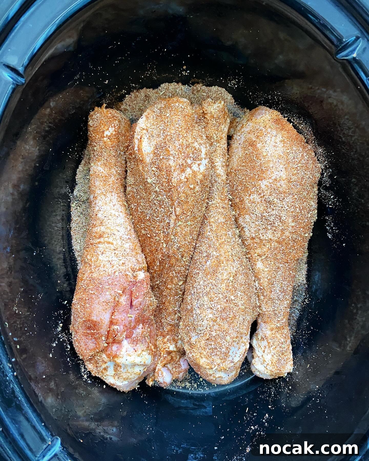 Slow Cooker Turkey Legs Recipe with Step-by-Step Video 4 overhead shot of cooked turkey legs in a black slow cooker