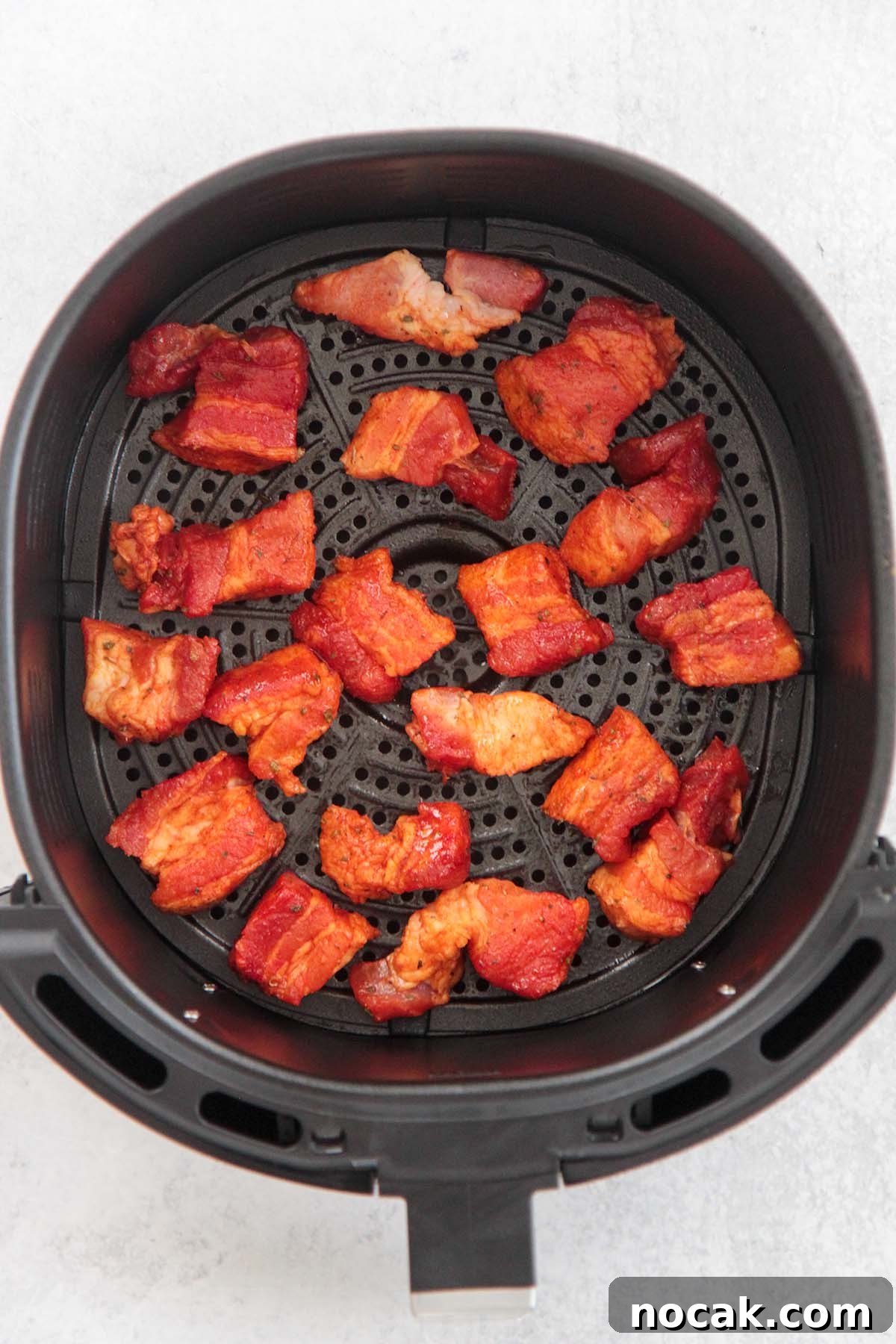 Crispy Air Fryer Pork Belly Recipe: Perfect Crackling in Minutes 5 pork belly in the air fryer basket.
