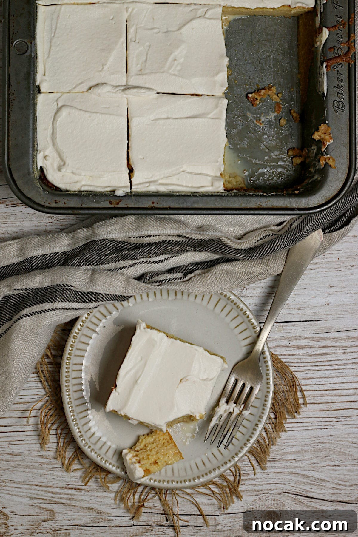 Gluten-Free Corn Tres Leches Cake Recipe for Moist, Flavorful Dessert 5 Overhead photo of a slice of Gluten-Free Corn Tres Leches cake on a small white plate.