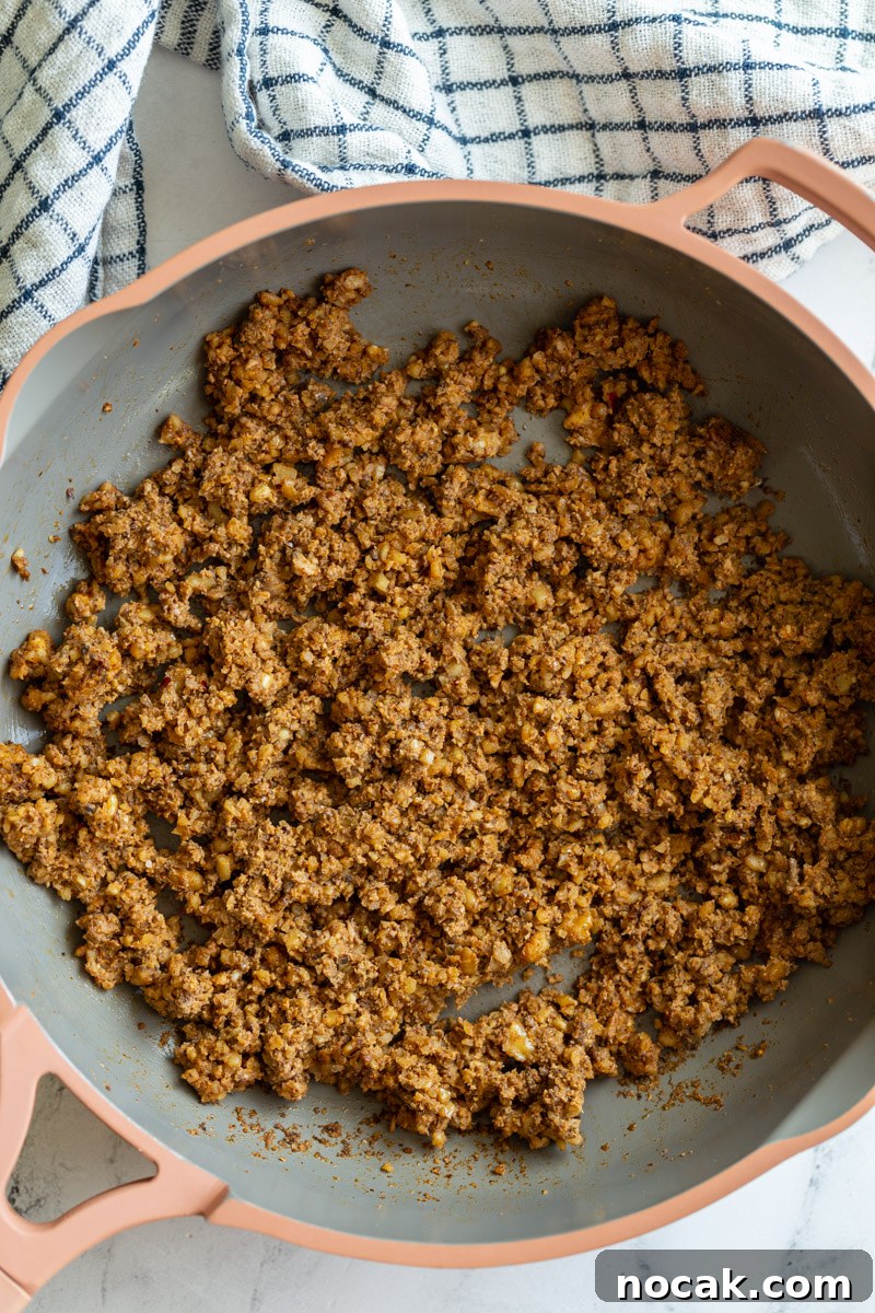 Walnut Taco Filling: Savory Plant-Based Meat Substitute for Tacos 3 mushroom and walnut taco meat in a pink skillet