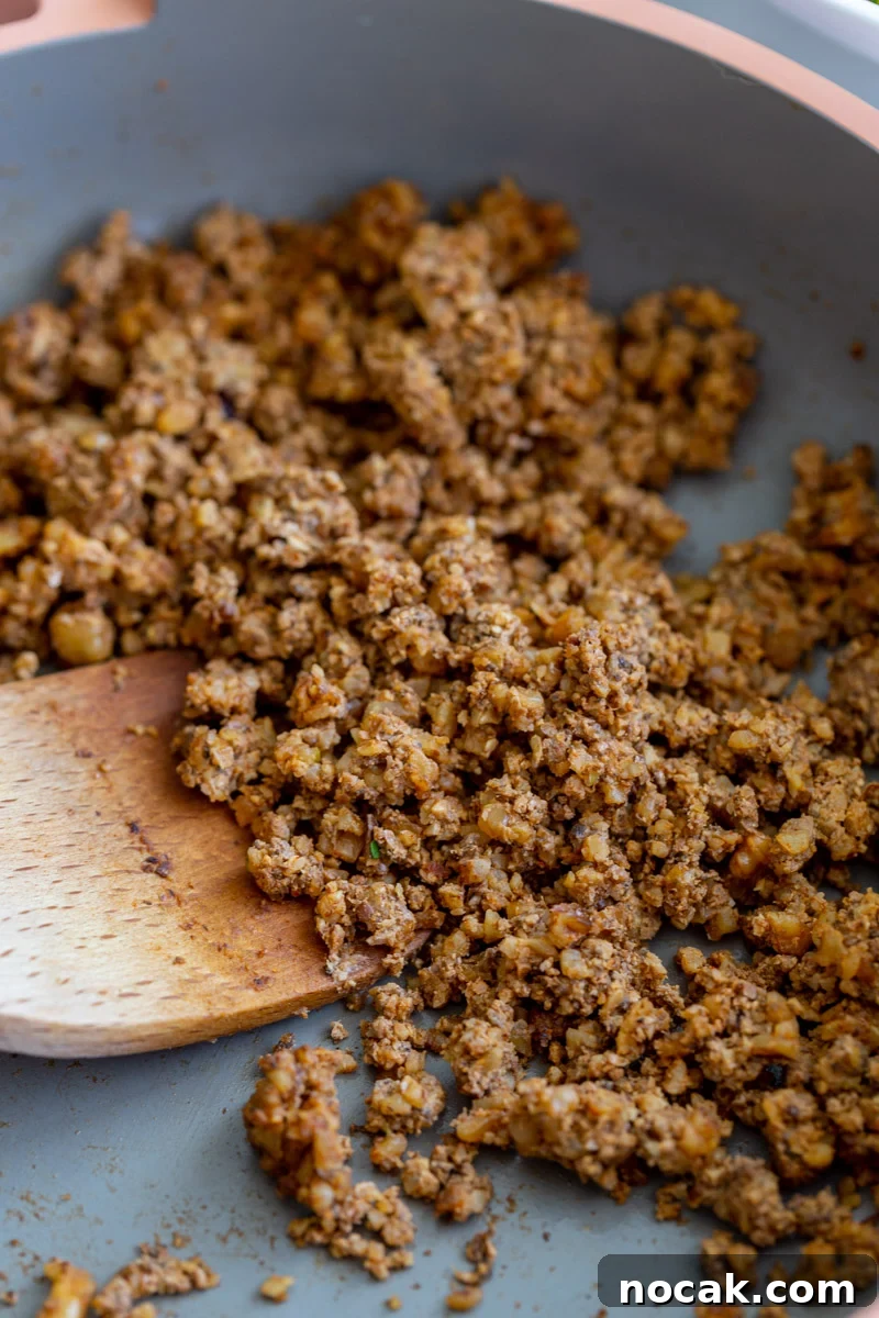 Walnut Taco Filling: Savory Plant-Based Meat Substitute for Tacos 5 mushroom taco meat in a pink skillet