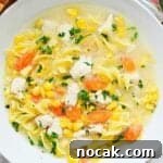 Chicken Corn Noodle Soup in white bowl