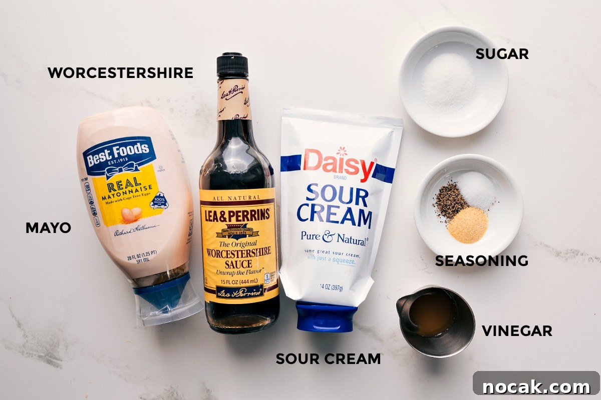 Dressing Ingredients For This 7 Layer Salad 7 layer salad dressing ingredients set out for easy assembly including mayo, Worcestershire sauce, sour cream, vinegar, seasoning, and sugar.
