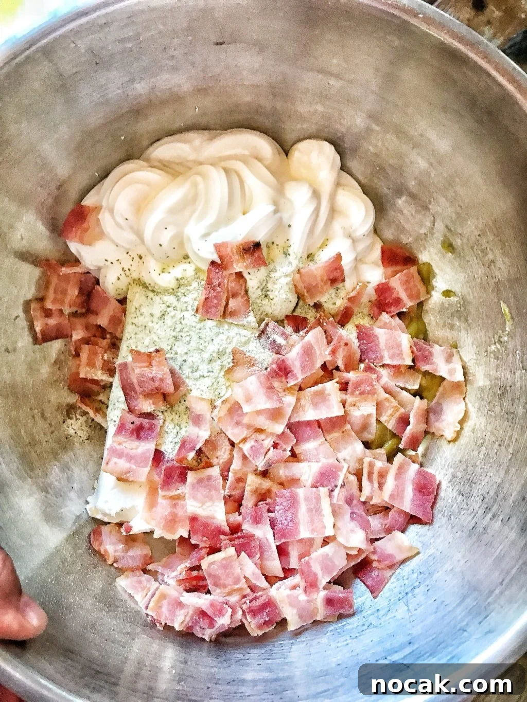 Dorito Dip Recipes: 10 Crowd-Pleasing Dips for Nacho Nights 4 Bacon bits, sour cream, and Ranch mix in a bowl