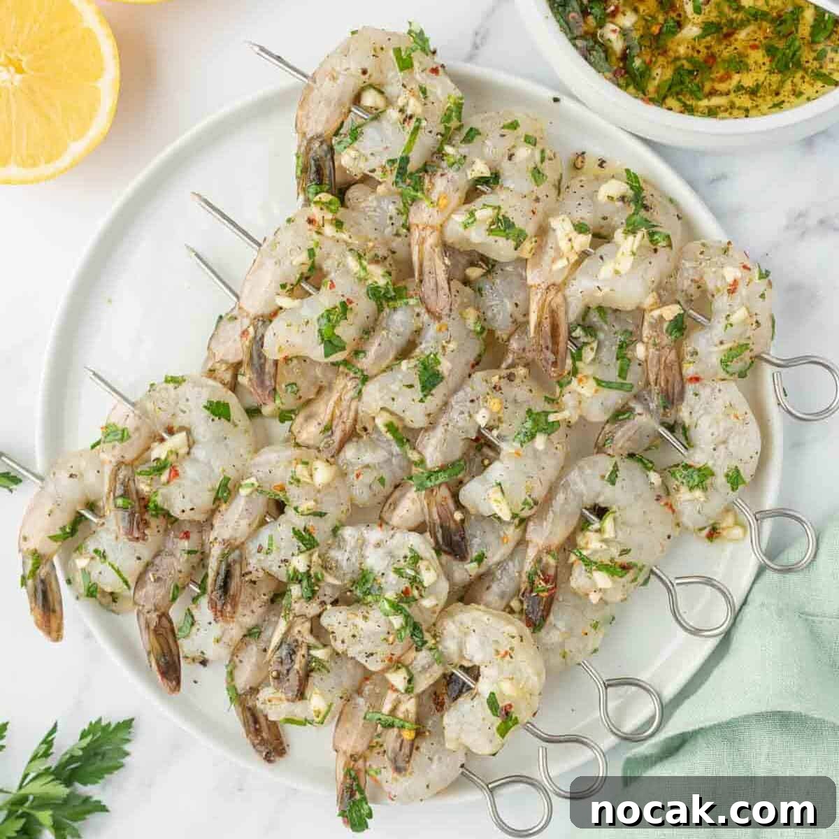 Garlic-Grilled Shrimp Skewers with Zesty Lemon Marinade 6 Shrimp skewers coated in a garlic citrus marinade.