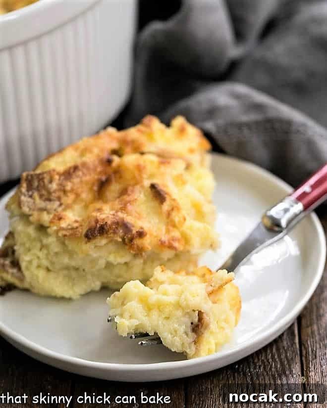Cheese Omelet - A delicious Cheese and Bread Souffle made in the oven! Super easy vegetarian entree and perfect for Lent or a meatless meal. Bite of cheese souffle on a red handled fork on a plate.