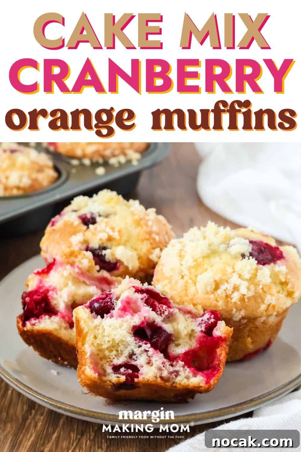 Cranberry Orange Muffins Made with Cake Mix 2 close-up view of cake mix cranberry orange muffins that are perfect for Thanksgiving and Christmas. One muffin is torn in half to show the berries inside, and all muffins are topped with streusel.