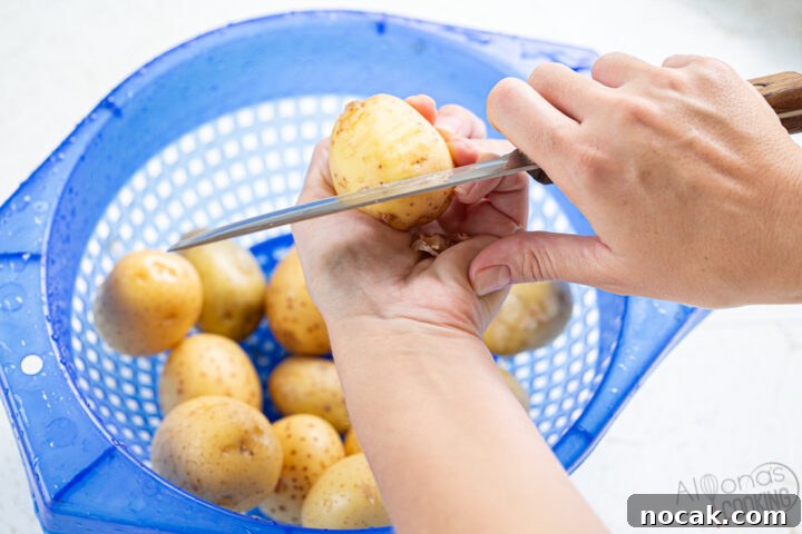 Potato Bliss: Boiled Baby Potatoes in Bacon Butter Sauce 3 how to peel baby potatoes with a knife scraping off the skins