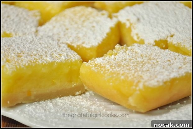 Close up of lemon bars on white plate