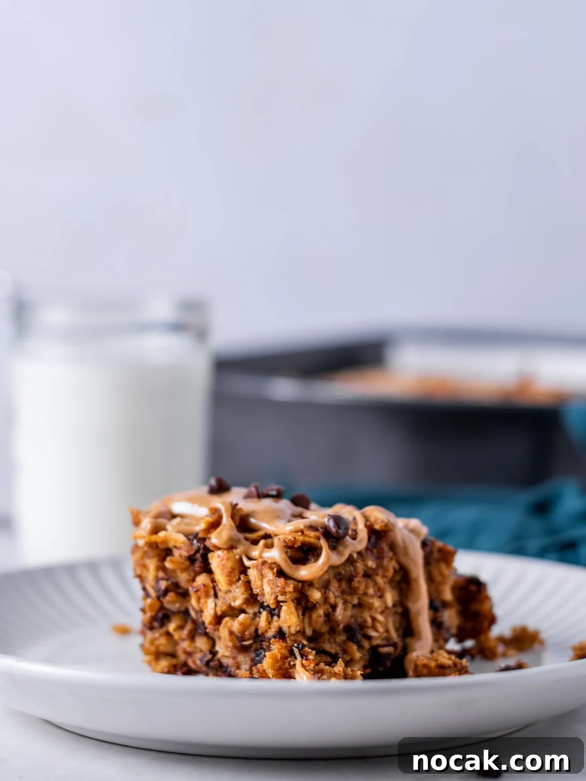 Peanut Butter Baked Oats with Maple and Banana 2 slice of peanut butter baked oatmeal and glass of milk