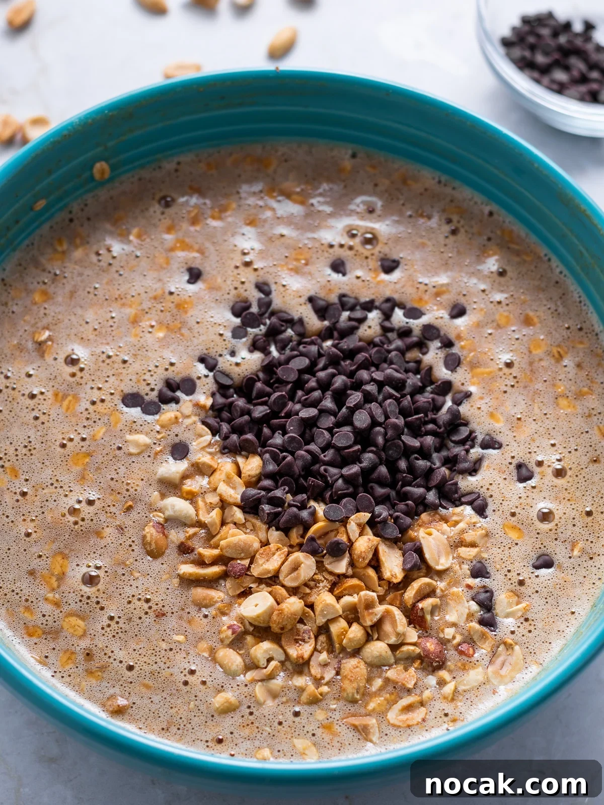 Peanut Butter Baked Oats with Maple and Banana 8 oatmeal mixture with chocolate chips and peanuts added