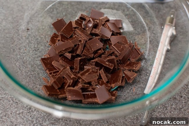 Preparing chocolate Chopped chocolate in a glass bowl