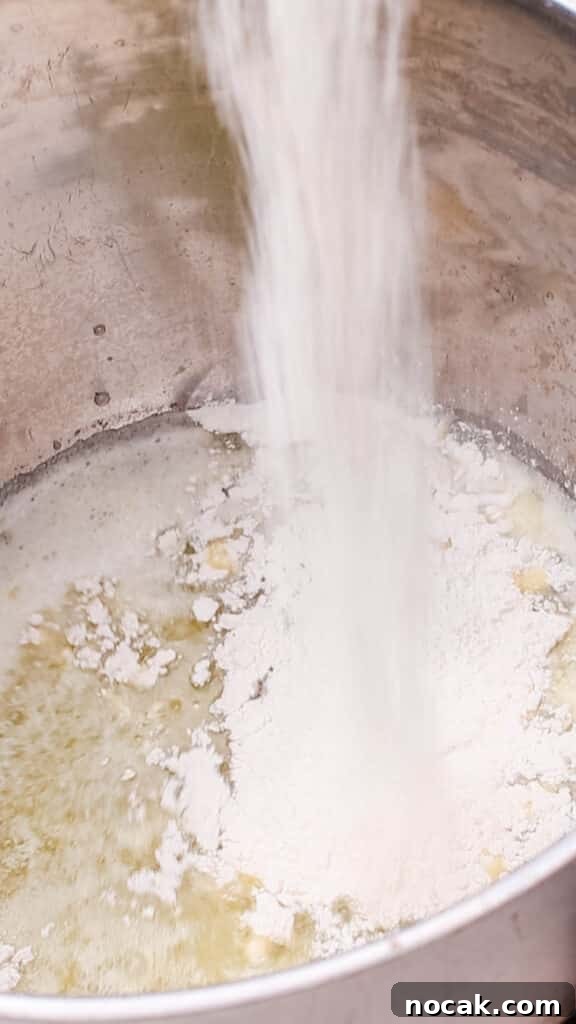 Creamy Cheese Sauce Recipe for Mac and Cheese 6 Combining butter and flour in a saucepan.