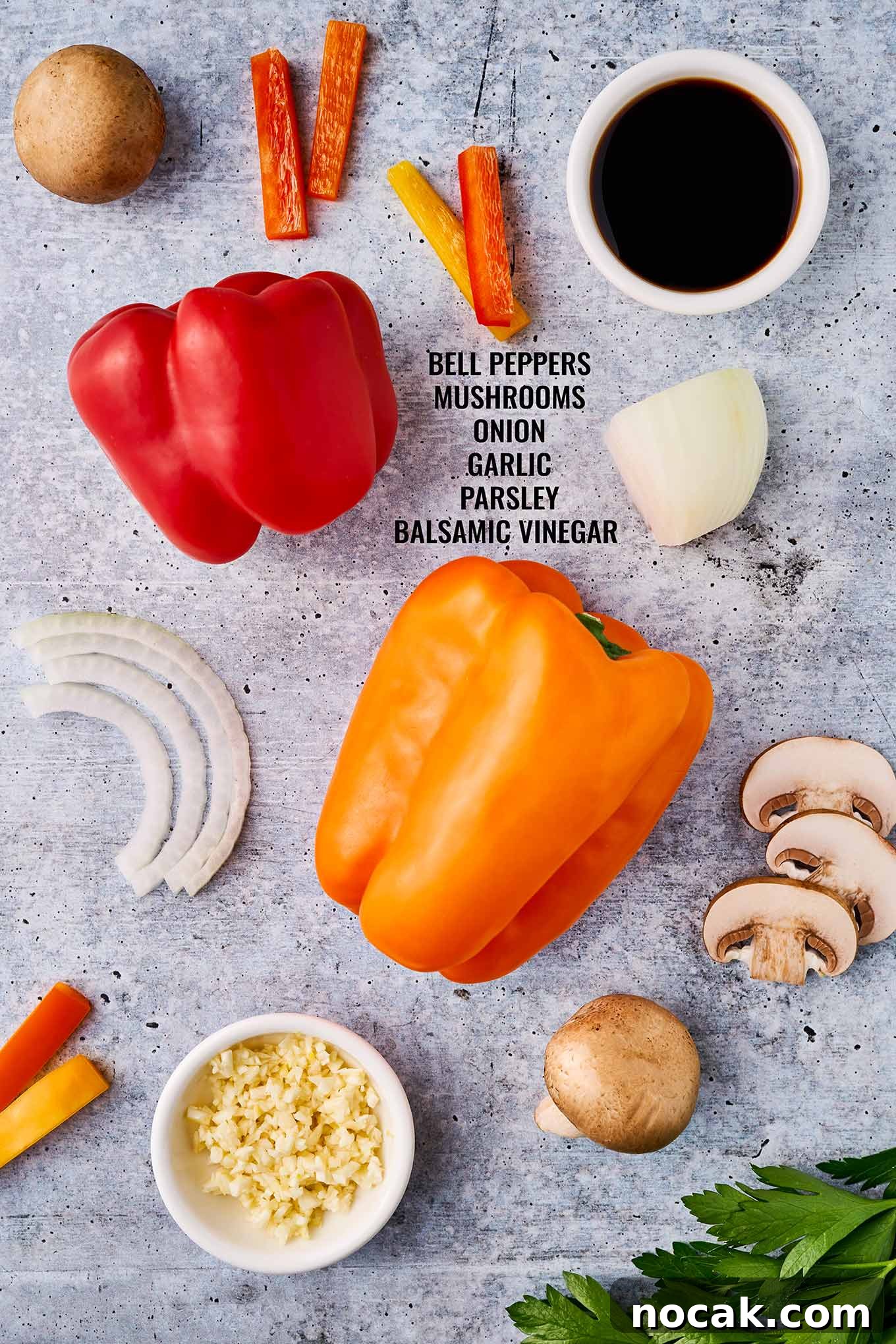 Sautéed Peppers, Mushrooms & Onions Recipe for Flavorful Sides 3 Ingredients to make sauteed peppers, mushrooms and onions on a concrete background, along with balsamic vinegar and minced garlic.