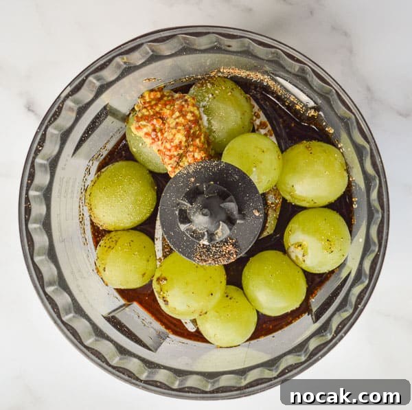 Whole30 Balsamic Mustard Salad Dressing Recipe 5 Grapes and balsamic vinegar in a food processor bowl