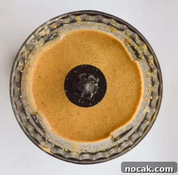 Whole30 Balsamic Mustard Salad Dressing Recipe 7 Creamy pale balsamic dressing in a clear dark bowl
