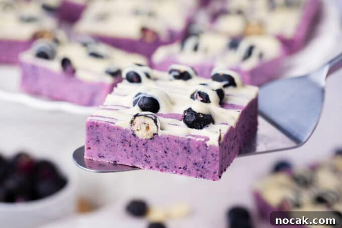 Creamy No-Bake Blueberry Fudge Recipe 3 Blueberry fudge on a serving spatula.