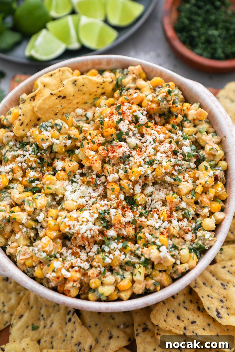 Mexican Street Corn Dip Recipe: Creamy Elote-Inspired Dip 8 An easy appetizer made with cooked corn, peppers and chiles, cotija cheese, sour cream cilantro and Mexican spices served with tortilla chips