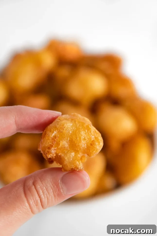 Crispy Fried Cauliflower Recipe with Zesty Dipping Sauce 3 Close-up photo of a piece of fried cauliflower
