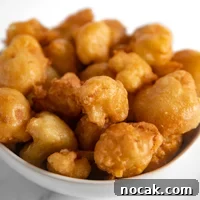 Square photo of a bowl of fried cauliflower
