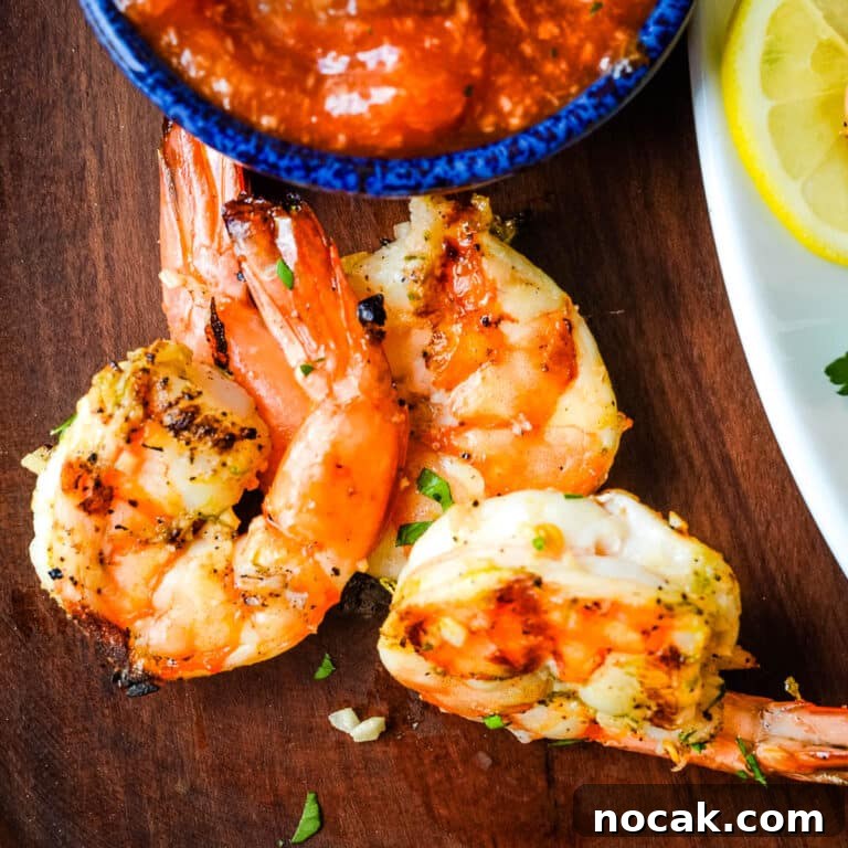 Citrus-Grilled Shrimp Cocktail with Zesty Dipping Sauce 12 grilled shrimp cocktail with lemon.
