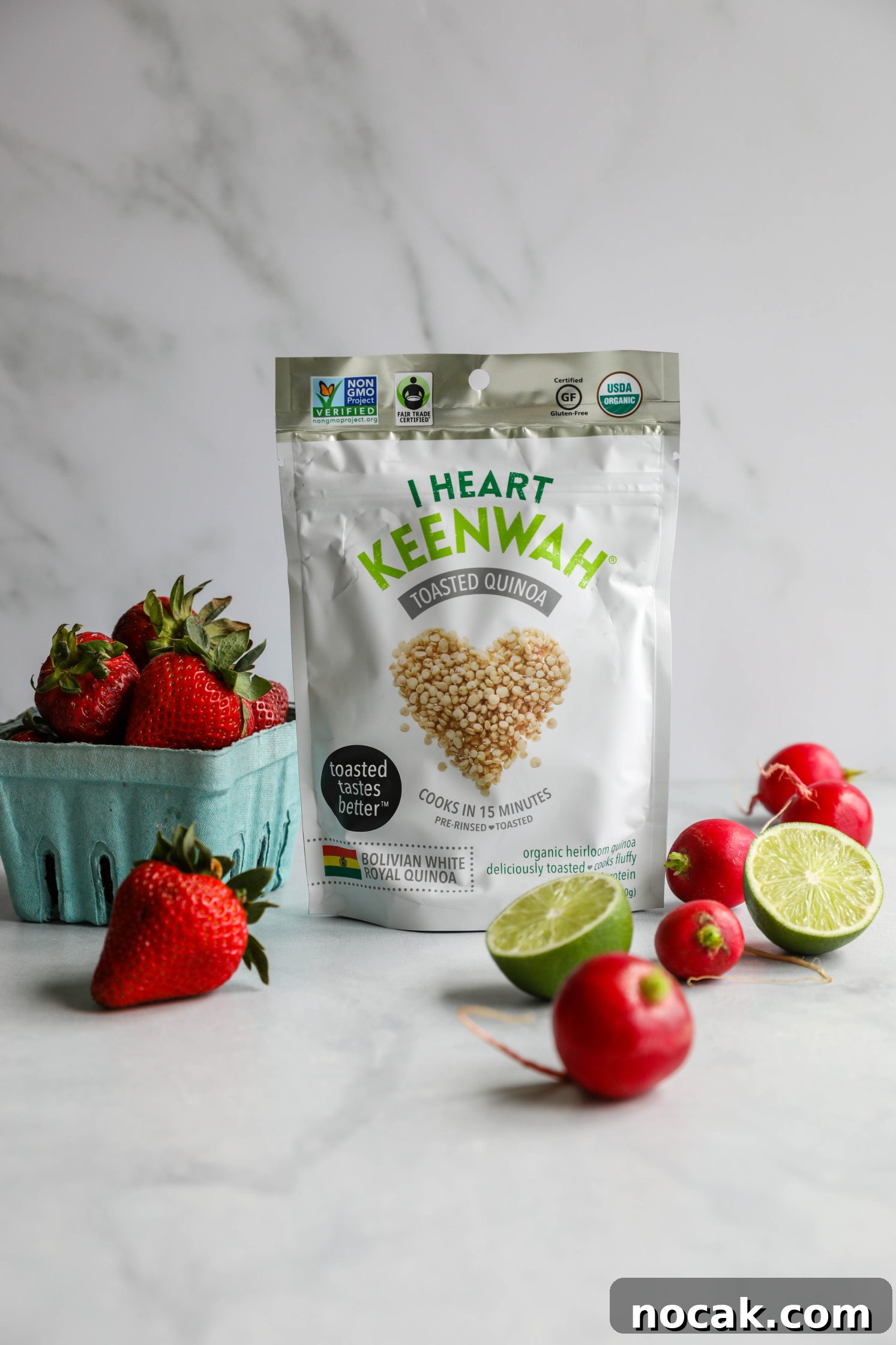 I Heart Keenwah bag with radishes and strawberries and two lime halves